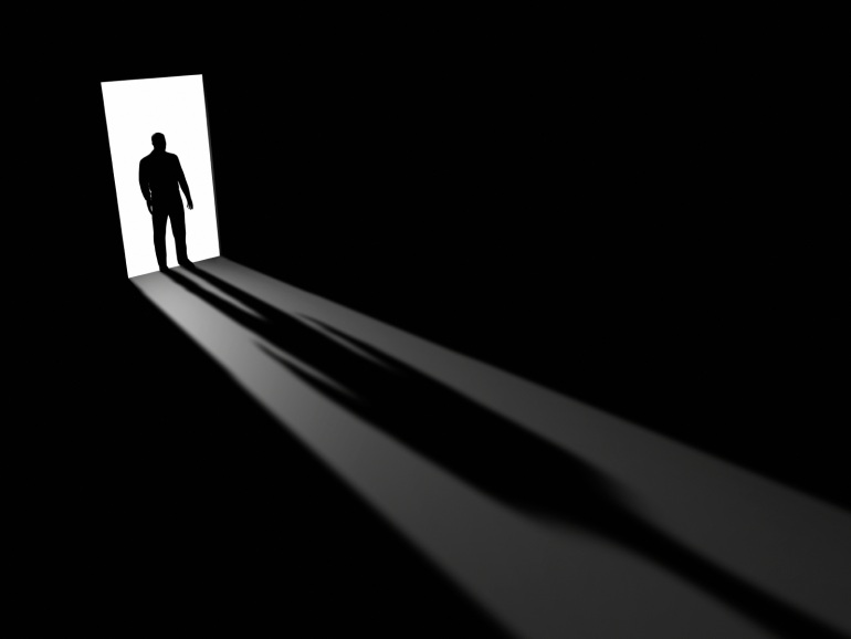 Silhouette of man in a doorway